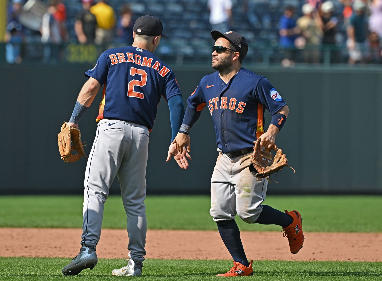 Sep 17, 2023; Kansas City, Missouri, USA; Houston Astros second baseman Jose Altuve (27) and Alex Bregman (2) celebrate after beating the Kansas City Royals at Kauffman Stadium. Mandatory Credit: Peter Aiken-USA TODAY Sports  